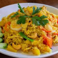 Pineapple Fried Rice · Fried rice of shrimps & chicken (or your choice), pineapple,
raisin, cashew, egg, tomato & o...
