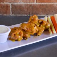 Mango Habanero Wings · Delicious chicken wings deep fried to perfection and tossed with mango habanero sauce