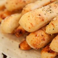 Garlic Cheese Sticks · Fresh garlic and cheese on a soft bread.
