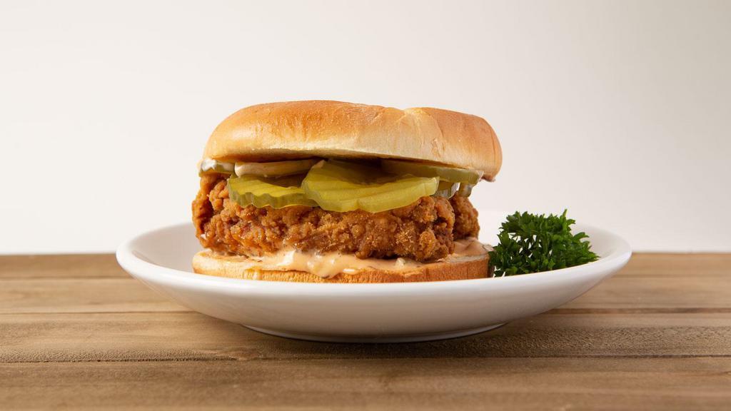Hot Chicken Sandwich · A spicy fried chicken breast with pickles on a toasted bun.