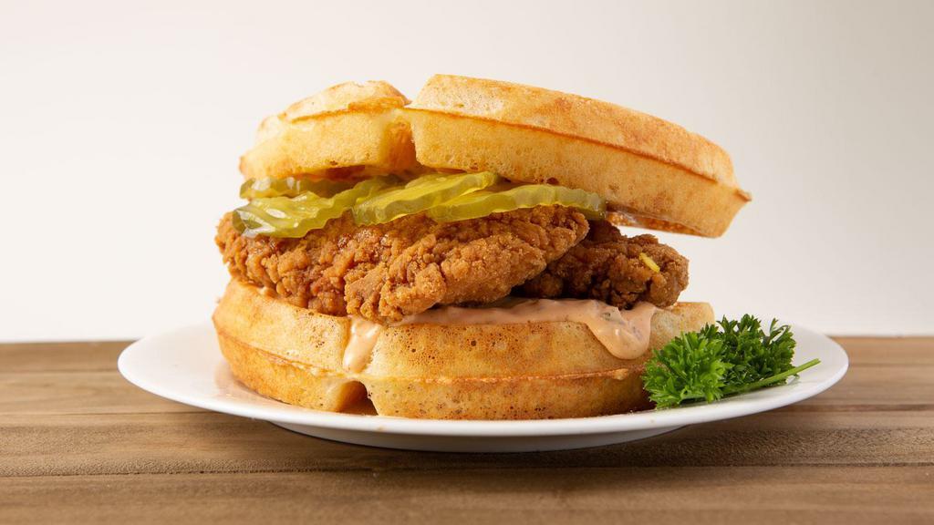 Chicken n Waffles Sandwich · A fried chicken breast drizzed with syrup between two waffles.