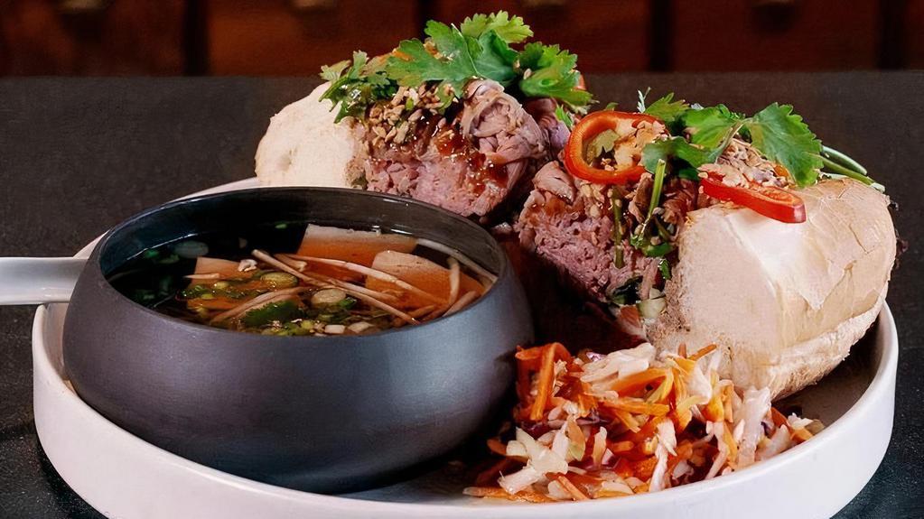 French Dip Pho Bo · five spice roasted beef, house-made pate, hoisin, shallot mayo, pickles, pho au jus dipping sauce