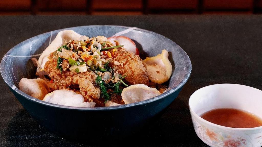 Turmeric Fried Fish Bowl · Banh hoi rice noodles, dill & onions, fermented shrimp & pineapple sauce, shrimp chips