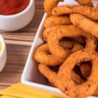 Onion Rings · Fresh cut onions battered and crisped to perfection and served with marinara dipping sauce.