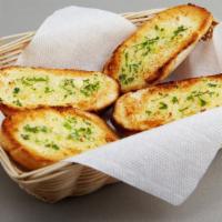 Garlic Bread · Half loaf fresh baked garlic bread with melted cheese and marinara dipping sauce.