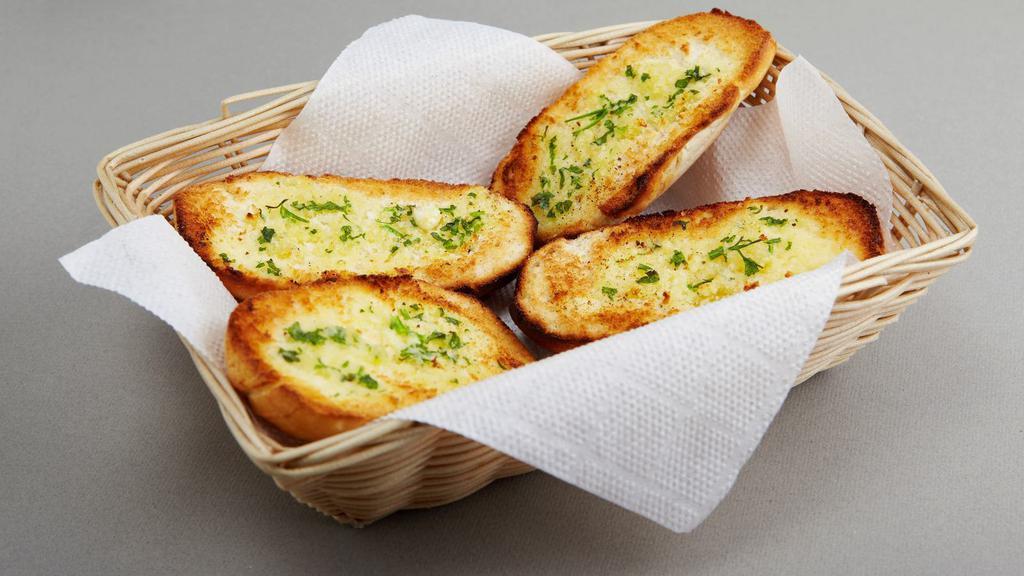 Garlic Bread · Half loaf fresh baked garlic bread with melted cheese and marinara dipping sauce.