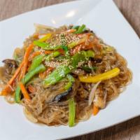 Japchae · Korean stir-fried glass noodles. Includes bell peppers, onions, green onions, and sesame see...