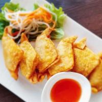 39. Veggie Fried Wonton (6) · Six pieces. Deep-fried wontons filled with mixture of vegetables and beans, served with swee...