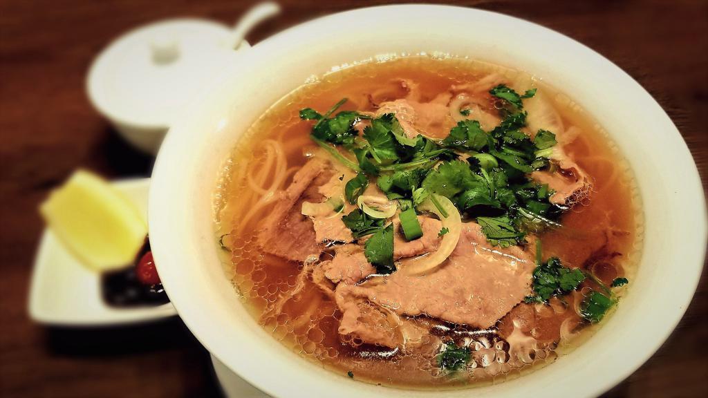 10. Beef Noodle Soup · Classic beef noodle soup included rare steak and well-done brisket, additional topping can be added. All natural and fresh ingredients, no MSG, cooked with filtered water.