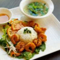 25. Grilled Shrimp Rice Plate · Combination of well-seasoned grilled shrimp and steamed white rice. Served with lettuce, car...