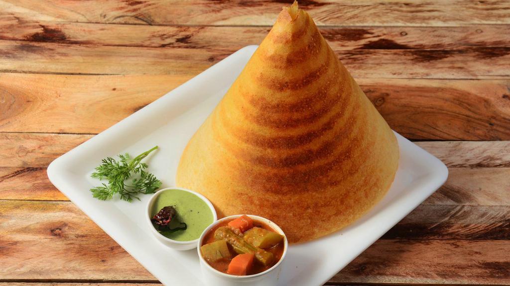 Plain Dosa · Thin pancake made from fermented batter consisting of lentils and rice, served with three chutneys and sambar.