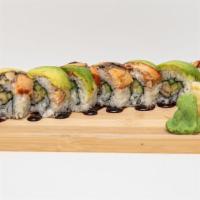 Dragon Roll · Shrimp tempura and cucumber topped with unagi, sliced avocado and unagi sauce.