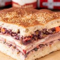 Muffuletta · This aint your traditional muffuletta! Stacked high with Italian mortadella (without pistach...