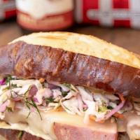 Sausage Melt · Served on a pretzel roll, Louisiana andouille Sausage, provolone cheese, herby 'slaw, creole...