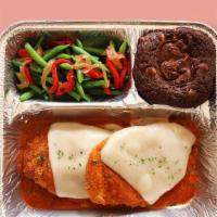 Tv Dinner Chicken Parmesan · Hearty meals made in-house, frozen in retro-style trays, and ready to pop in the oven when y...