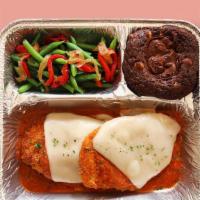 TV Dinner Chicken Parmesan · Hearty meals made in-house, frozen in retro-style trays, and ready to pop in the oven when y...