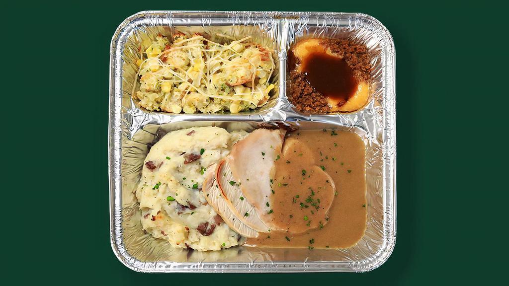 Tv Dinner Roasted Turkey · Hearty meals made in-house, frozen in retro-style trays, and ready to pop in the oven when you need them. . Roasted turkey breast served with housemade gravy, mashed potatoes, sweet corn stuffing, with a huckleberry-apple cake dessert