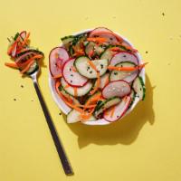 Pickled Cucumber Salad · thinly sliced cucumbers, radishes, shredded carrots + toasted sesame seeds - marinated in ri...
