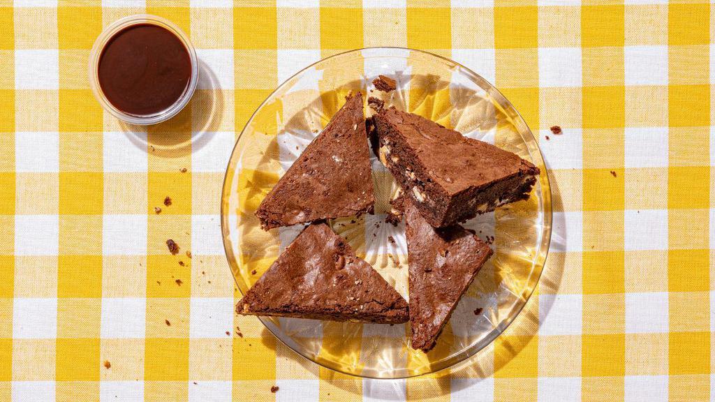Brownie Bites · housemade chocolate brownies baked with white chocolate chips with chocolate sauce on the side [980 cal]