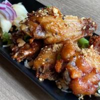 Pad Thai Wing (5 Pc,) · Chicken Wings,  pad Thai favor sauce, and hint of ground peanut and crashed pepper.