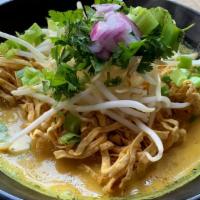 Chiang Mai Ramen (Kao-Soi) · Northern style noodle soup. crispy egg noodle, onion, bean sprout, cilantro, simmered yellow...