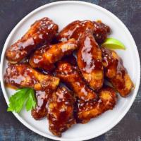 Smoking BBQ Bliss Chicken Wings · Fresh chicken wings breaded, fried until golden brown, and tossed in barbecue sauce. Served ...