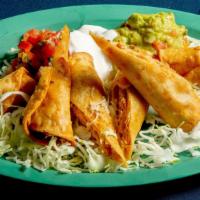 Chicken Flautas Plate · Three rolled corn tortillas, deep-fried and topped with guacamole, sour cream, pico de gallo...