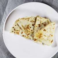 Chicken Fajita Quesadillas · A grilled flour tortilla filled with chicken fajitas & Monterey Jack cheese. served with gua...
