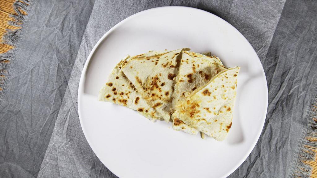 Quesadilla · With sour cream and guacamole, chicken or beef.