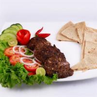Chabli Kabob Plate · Fresh ground beef kabob plate with steamed rice, salad, hummus and side of pita bread.