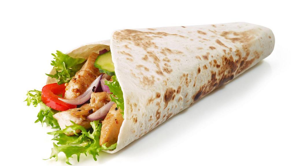 The Chicken Kabob Wrap · Fresh chicken kabob sizzling served in a wrap with lettuce, tomatoes, onions, tzatziki sauce, and tahini sauce.