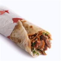 The Adana Kabob Wrap · Adana style kabob sizzling served in a wrap with lettuce, tomatoes, onions, tzatziki sauce, ...