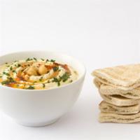Hummus with Pita Bread · Exotic hummus dip served with side of pita bread.