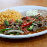 Steak a la Mexicana · Chopped rib eye sauteed with onions, tomatoes, cilantro and fresh jalapeños.