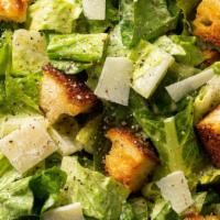 Caesar Salad · Baby hearts of romaine shaved parmesan cheese croutons and caesar dressing.