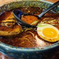 Black Garlic Ramen · Soy sauce broth with corn bean sprouts green onion seaweed soft boiled egg and chashu pork.