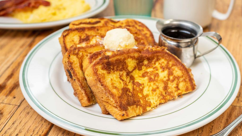Cinnamon French Toast · 3 slices of thick slices French Toast, served with syrup and butter.