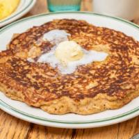 Oatmeal Pancake · Made with oats, bran and wheat flour. One big pancakes served with hot blueberry sauce or sy...