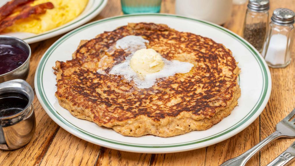 Oatmeal Pancake · Made with oats, bran and wheat flour. One big pancakes served with hot blueberry sauce or syrup