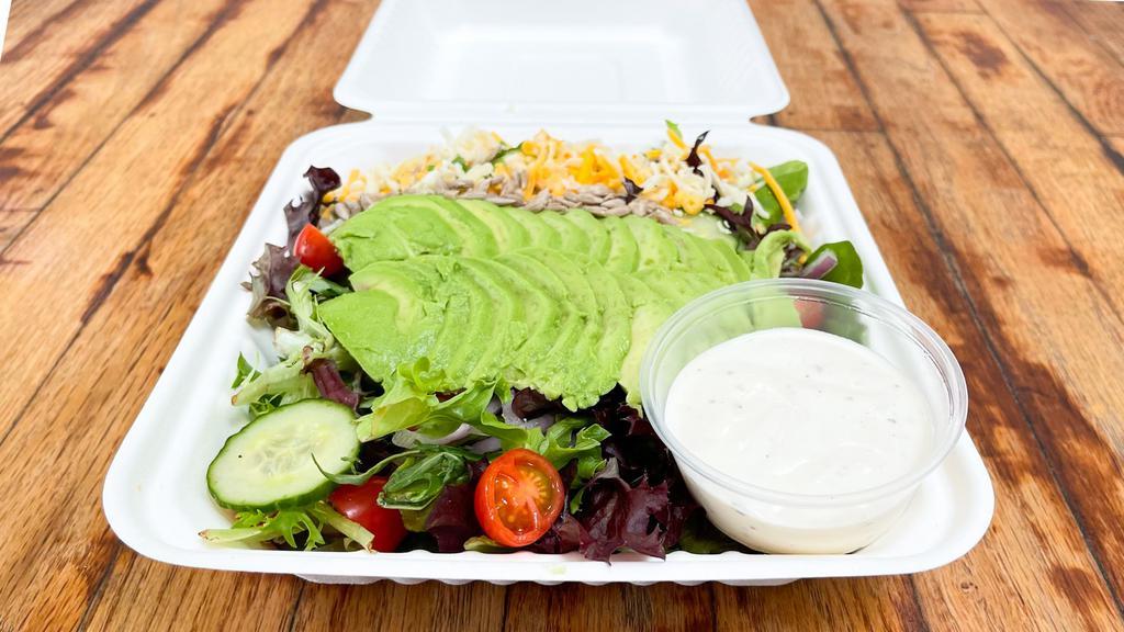 Avocado Salad · Vegetarian dish. Mixed greens with avocado, cheddar and provolone cheeses, tomatoes, cucumber, mushroom, and sunflower seeds with ranch dressing.