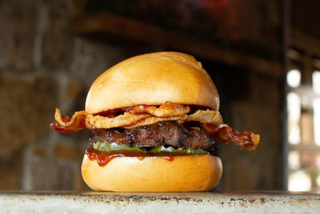 Bbq Bacon · crank the flavor-volume with Bacon…the undisputed legend–crispy onions, sliced bacon, BBQ sauce, pickles