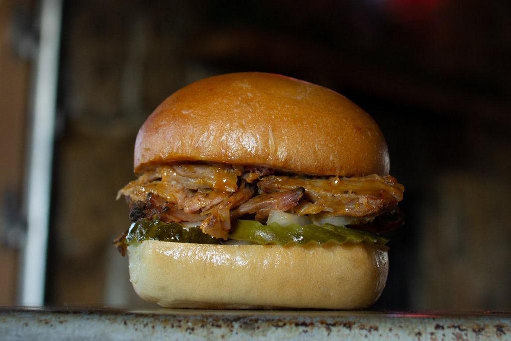 Pulled Pork · —a little bit country, a little bit rock n’ roll, a whole lotta flavor–gold BBQ sauce, pickles, and chopped onion