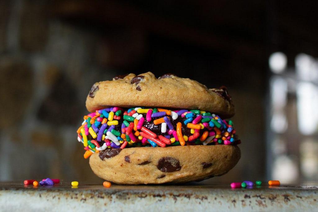 Cookie Slider · the perfect encore to any concert. fudge brownie sandwiched between 2 fresh baked chocolate chip cookies with sprinkles for the grand finale (*contains nuts)