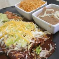 1 Enchilada · Corn tortilla rolled with your choice of meat. Your choice of red, green, or mole salsa. Top...