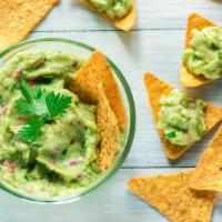 Chips & Guacamole · Delicious plate of Tortilla chips, served with a side of Guacamole in customer's preference ...