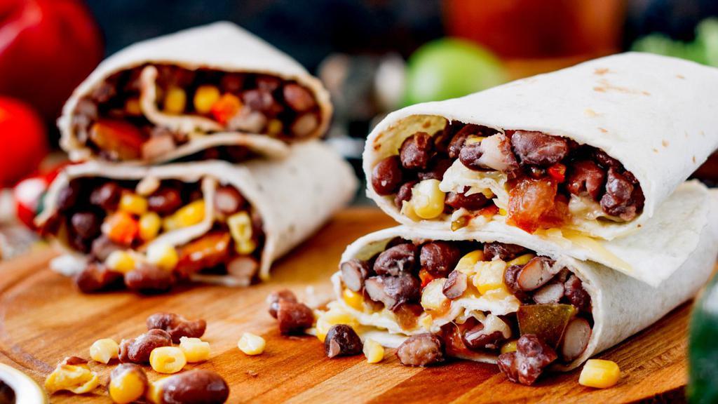 Super Vegetarian Burrito · Mouthwatering burrito made with rice, beans, cheese, guacamole, sour cream, lettuce, tomato, and salsa.