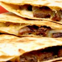 Quesadilla Suiza · Delicious quesadilla made with cheese, customer's choice of meat, and salsa.
