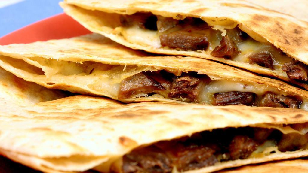 Quesadilla Suiza · Delicious quesadilla made with cheese, customer's choice of meat, and salsa.