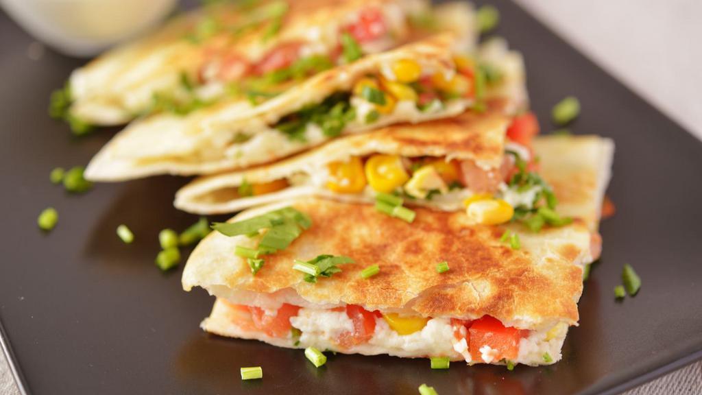 Garden Vegetables Quesadilla · Delicious quesadilla made with fresh garden vegetables, cheese and salsa.