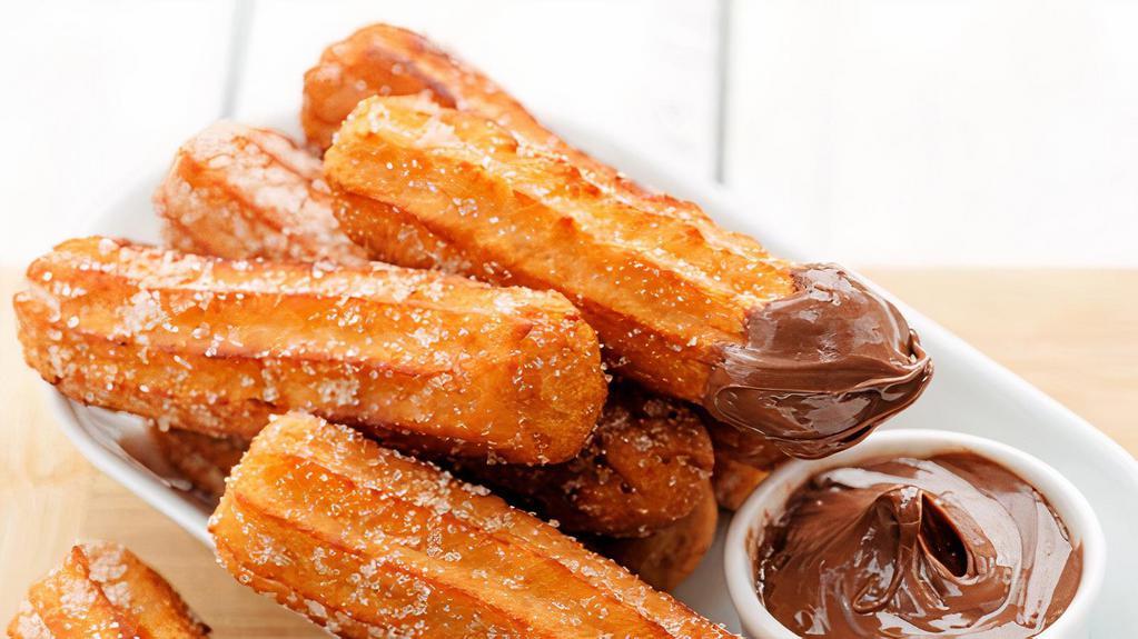 Churro · Mexican fried sugar pastry, with a drizzle of cinnamon.